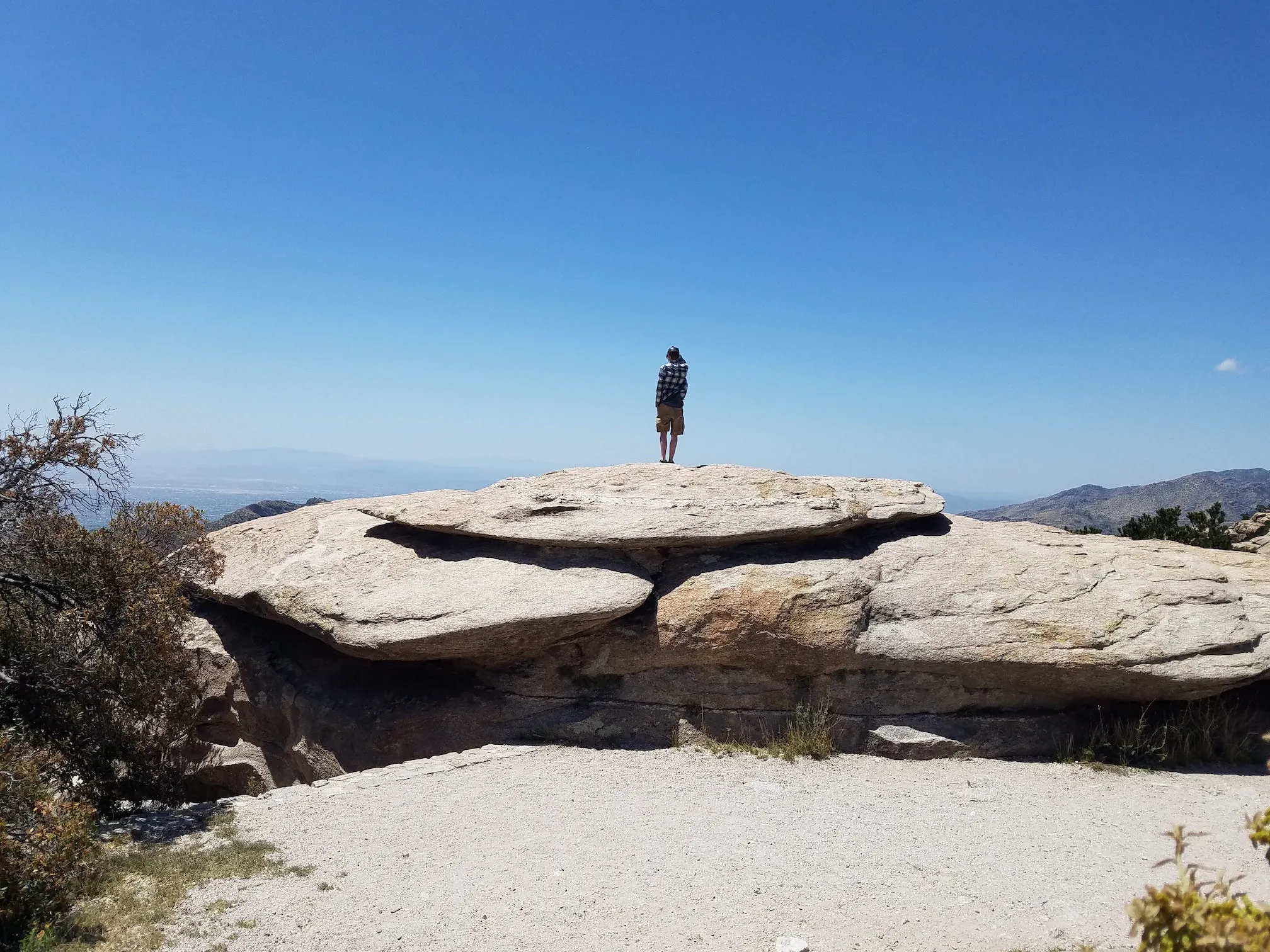Me, standing on a rock high up in the mountains surrounding Mt. Lemmon. Only the cloudless sky is visible in the background